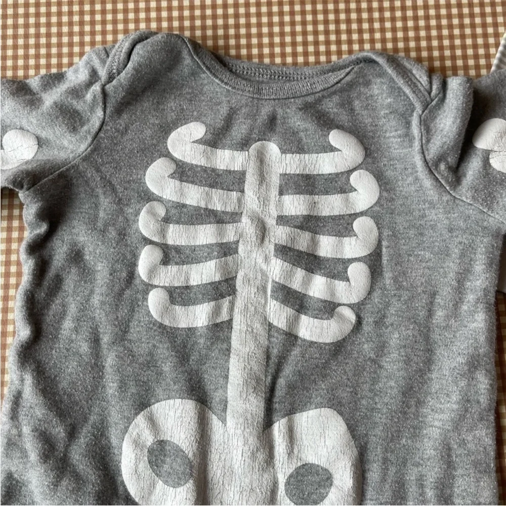 Skeleton‎ long sleeve one piece jumpsuit and striped one piece. Diff. Sizes
